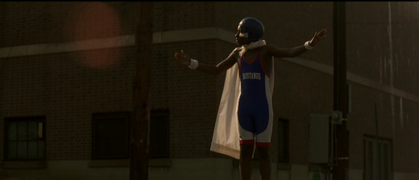 George Directs Traffic in a Football Helmet and Cape