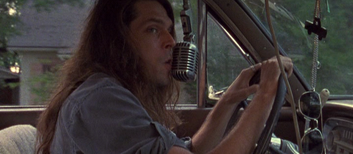 Man Driving and Projecting His Ramblings To Speakers Mounted To His Car