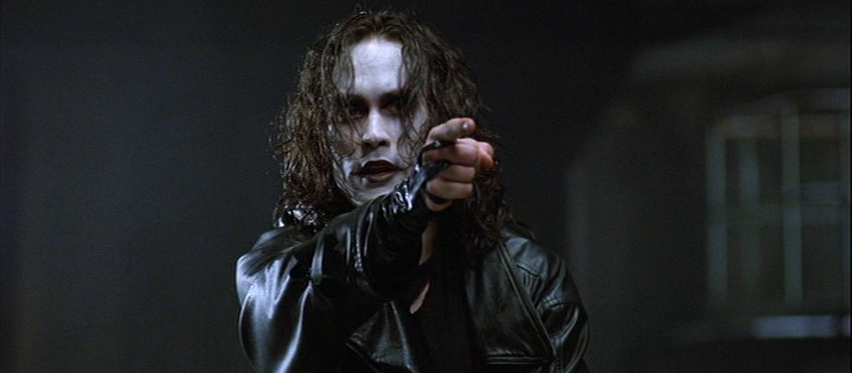 Brandon Lee as Eric Draven Pointing