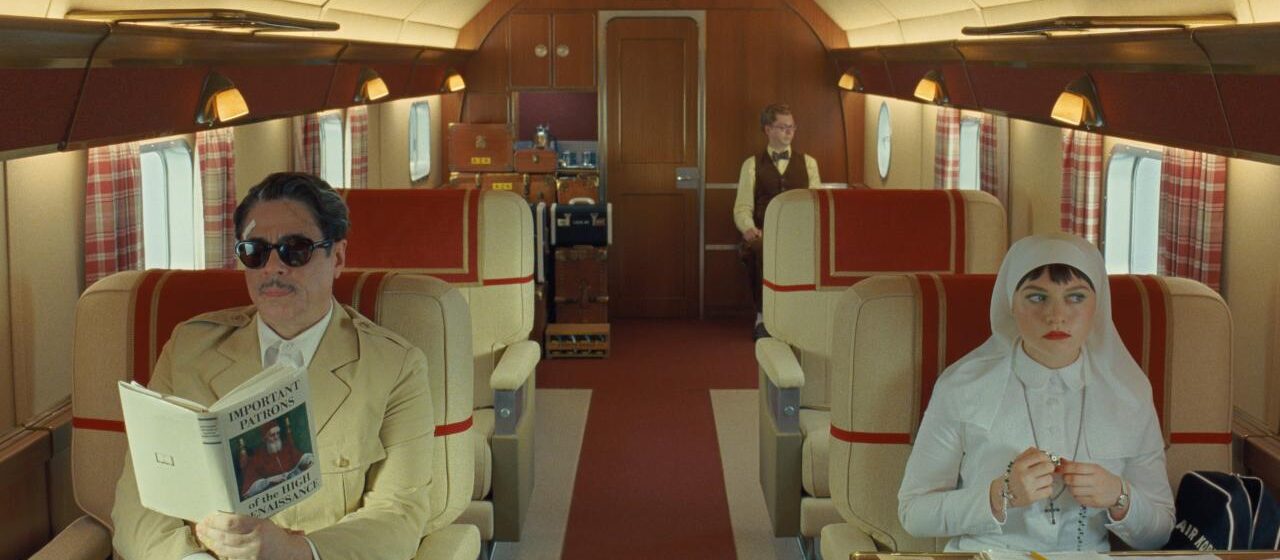 Benicio del Toro, Mia Threapleton, and Michael Cera in The Phoenician Scheme