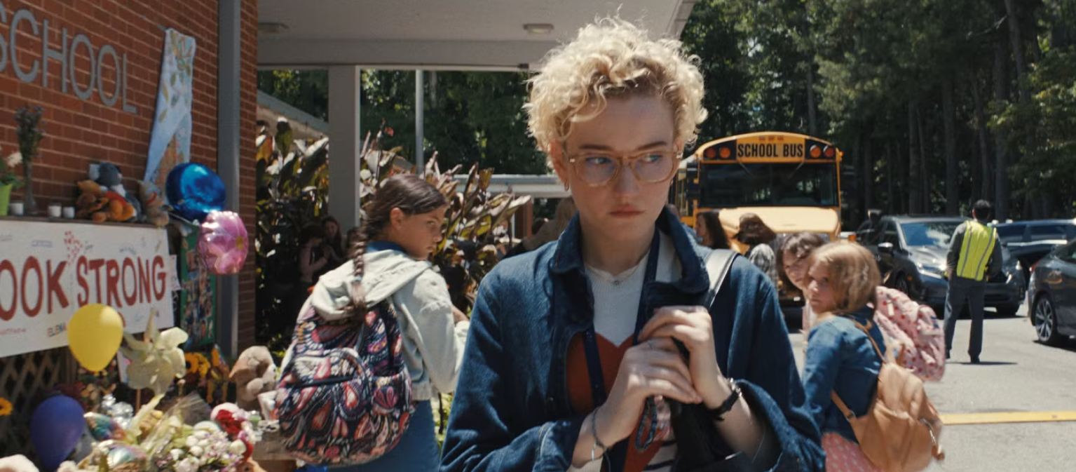Julia Garner as Justine Gandy